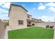 Spacious backyard has well-maintained lawn, cozy patio, and fire pit seating at 1631 Desert Path Ave, North Las Vegas, NV 89032