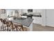 Open kitchen featuring gray countertops, stainless steel appliances, and barstool seating at 1631 Desert Path Ave, North Las Vegas, NV 89032