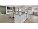 Modern kitchen with a large island, stainless steel appliances, and open to the living area at 1631 Desert Path Ave, North Las Vegas, NV 89032
