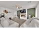 Bright living space with modern fireplace, neutral décor, and open layout at 1631 Desert Path Ave, North Las Vegas, NV 89032