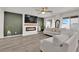 Cozy living room featuring a fireplace, large windows, and neutral decor at 1631 Desert Path Ave, North Las Vegas, NV 89032