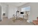 Bright office with a white desk, chair, and natural light from a window with neighborhood views at 1631 Desert Path Ave, North Las Vegas, NV 89032