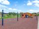 A vibrant playground area with colorful slides, swings, and climbing structures for  at 1631 Desert Path Ave, North Las Vegas, NV 89032