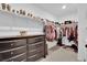 Spacious walk-in closet with custom shelving for shoes and hanging clothes at 1631 Desert Path Ave, North Las Vegas, NV 89032