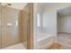 A bathroom showcasing a shower and a bathtub in an ample space at 1716 Klamath Falls Way, Las Vegas, NV 89128