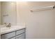 Bathroom features a white vanity, silver fixtures, and a bright mirror at 1716 Klamath Falls Way, Las Vegas, NV 89128