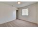 A simple bedroom features neutral carpet, closet and bright natural light at 1716 Klamath Falls Way, Las Vegas, NV 89128