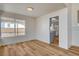Dining room boasts wood-look floors, recessed lighting, and large windows offering backyard views and abundant natural light at 1716 Klamath Falls Way, Las Vegas, NV 89128