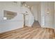 Bright foyer with soaring ceilings, wood-look flooring, and staircase; the neutral palette provides a modern, airy feel at 1716 Klamath Falls Way, Las Vegas, NV 89128
