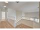 Upstairs hallway with carpet and view into living room at 1716 Klamath Falls Way, Las Vegas, NV 89128