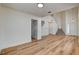 Spacious living area features wood-look floors, neutral walls, high ceilings, and a seamless transition into the foyer at 1716 Klamath Falls Way, Las Vegas, NV 89128