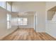 Bright living room features wood-look flooring, recessed lighting, and ample natural light from the large windows at 1716 Klamath Falls Way, Las Vegas, NV 89128