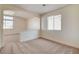 Bright loft featuring carpet flooring, bright white walls, and arched entrance at 1716 Klamath Falls Way, Las Vegas, NV 89128
