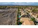 Aerial view of a neighborhood and homes with pools at 1779 Antelope Valley Ave, Henderson, NV 89012