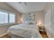 Bedroom featuring a king bed, plantation shutters, and a serene, neutral color scheme at 1779 Antelope Valley Ave, Henderson, NV 89012