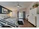 Bedroom with a ceiling fan and white wainscoting, offering a cozy and bright space at 1779 Antelope Valley Ave, Henderson, NV 89012