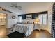 Bedroom with white wainscoting, plantation shutters, and door to attached bath offering a cozy and bright space at 1779 Antelope Valley Ave, Henderson, NV 89012