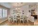 Inviting dining room featuring a wood floor and decorative lighting at 1779 Antelope Valley Ave, Henderson, NV 89012
