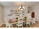 Bright dining room with wood table, elegant chandelier, and stylish decor at 1779 Antelope Valley Ave, Henderson, NV 89012