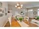 Open dining room boasts wood table, decor, and access to living areas at 1779 Antelope Valley Ave, Henderson, NV 89012
