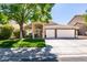 Charming home with a well-maintained lawn and a three-car garage at 1779 Antelope Valley Ave, Henderson, NV 89012