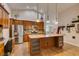 Well-lit kitchen with stainless steel appliances, pendant lighting, and granite countertops at 1779 Antelope Valley Ave, Henderson, NV 89012