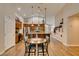 Open concept kitchen with a breakfast bar, wooden cabinets, and stainless steel appliances at 1779 Antelope Valley Ave, Henderson, NV 89012