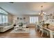 Charming living area with wood floors, plantation shutters, and neutral tones at 1779 Antelope Valley Ave, Henderson, NV 89012