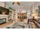 Open floor plan with hardwood floors, seamlessly connecting the living room, dining area, and kitchen at 1779 Antelope Valley Ave, Henderson, NV 89012