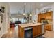 Well-lit kitchen with modern appliances overlooking an open living space at 1779 Antelope Valley Ave, Henderson, NV 89012