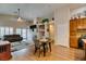Open living area with fireplace, vaulted ceilings, and wood-style flooring at 1779 Antelope Valley Ave, Henderson, NV 89012