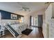 Primary bedroom with dark wood floors, a high ceiling fan, and a dog ramp at 1779 Antelope Valley Ave, Henderson, NV 89012