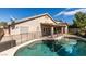 Backyard features refreshing pool, patio, and secure fencing at 1779 Antelope Valley Ave, Henderson, NV 89012