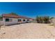 A large, blank canvas backyard ready for landscaping with block wall and home exterior at 2112 Hollow Oak Ave, North Las Vegas, NV 89031