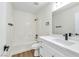 Bathroom features a tub and shower combination and modern vanity at 2112 Hollow Oak Ave, North Las Vegas, NV 89031