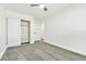 Bedroom features gray carpet, a closet, and one entry door at 2112 Hollow Oak Ave, North Las Vegas, NV 89031