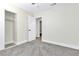 Bedroom with closet and attached bath featuring neutral walls, carpet and natural light at 2112 Hollow Oak Ave, North Las Vegas, NV 89031