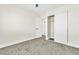 Bedroom featuring gray carpet, a closet, and one entry door at 2112 Hollow Oak Ave, North Las Vegas, NV 89031