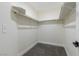 Walk-in closet with shelving and rod provides organized storage in this home at 2112 Hollow Oak Ave, North Las Vegas, NV 89031