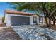 Well maintained house with spacious driveway and attached garage in a quiet neighborhood at 2112 Hollow Oak Ave, North Las Vegas, NV 89031