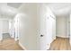 Hallway features wood-look floors and bright white doors at 2112 Hollow Oak Ave, North Las Vegas, NV 89031