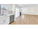 Bright kitchen with modern appliances opens to the living room at 2112 Hollow Oak Ave, North Las Vegas, NV 89031