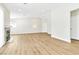 Bright open-concept living room with vaulted ceilings and wood-look floors at 2112 Hollow Oak Ave, North Las Vegas, NV 89031