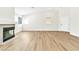 Bright living space featuring wood-look floors, neutral paint, high ceilings and a minimalist fireplace at 2112 Hollow Oak Ave, North Las Vegas, NV 89031