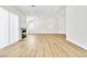 Bright open-concept living room with vaulted ceilings, fireplace, and wood-look floors at 2112 Hollow Oak Ave, North Las Vegas, NV 89031