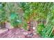 Lush landscaping featuring a stylish water fountain for a soothing garden ambiance at 2205 Sandstone Cliffs Dr, Henderson, NV 89044