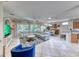 Bright open-concept living area features a large sectional sofa and views to backyard at 2205 Sandstone Cliffs Dr, Henderson, NV 89044