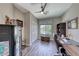 Office space with wood floors, desk, and views of lush, landscaped backyard at 2205 Sandstone Cliffs Dr, Henderson, NV 89044