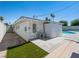 White house showing the side yard, pool, and extra storage unit in the backyard at 2245 Sombrero Dr, Las Vegas, NV 89169