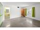 Bright bedroom with cement floors, a bathroom and large windows at 2245 Sombrero Dr, Las Vegas, NV 89169
